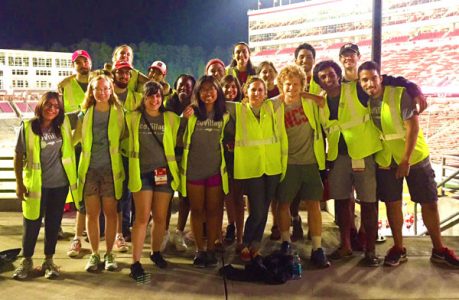 Students from the NC State Stewards and EcoVillage assist with zero waste efforts at Carter-Finley Stadium.