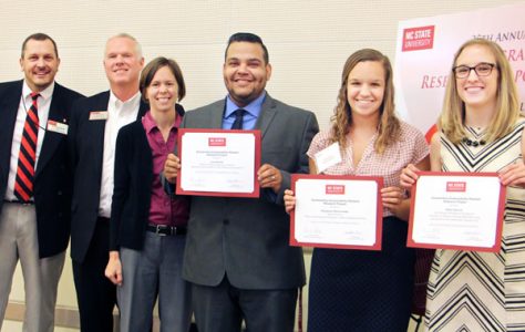 (Left to right) University representatives Chris Ashwell (Office of Undergraduate Research), Dean Mike Mullen (Division of Academic and Student Affairs) and Carla Davis (University Sustainability Office) presented awards to sustainability research winners Luis Roldan, Stephanie Wenclawski and Hallie Hartley.