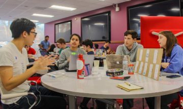 163 students competed in Make-A-Thon, NC State's sustainability innovation challenge. Students gathered around tables creating sustainable solution prototypes for Make-A-Thon.