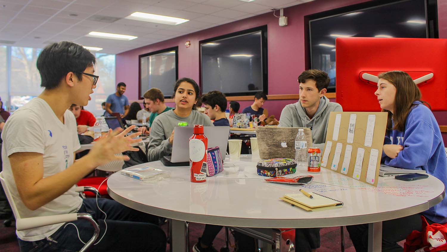 163 students competed in Make-A-Thon, NC State's sustainability innovation challenge. Students gathered around tables creating sustainable solution prototypes for Make-A-Thon.