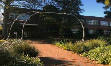 The artful arbor awaits the Spring, when plants and vines installed in November will begin to fill in around the new structure.