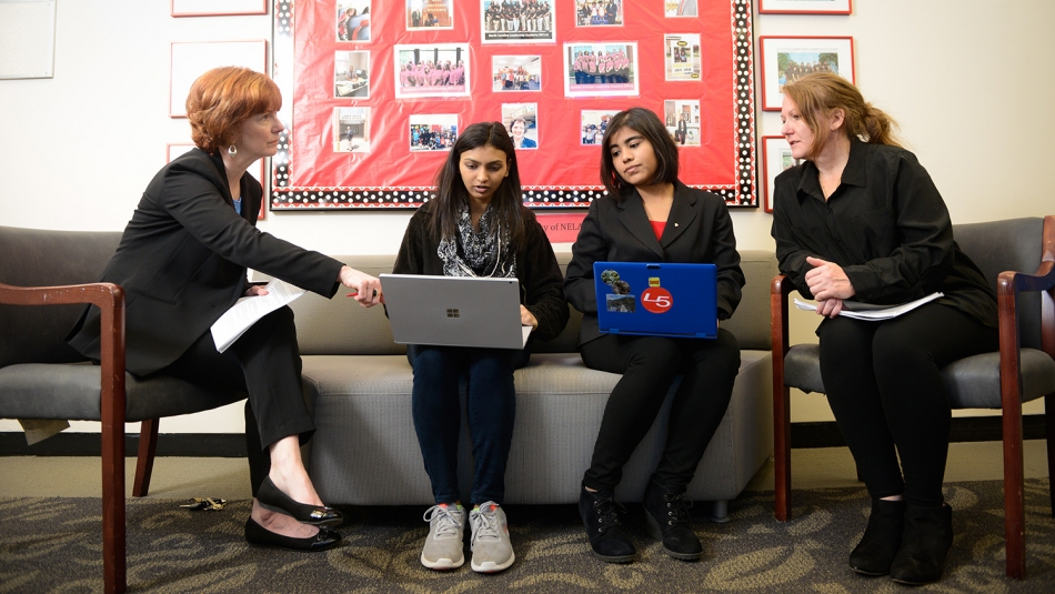 NC State psychologist Mary Haskett, left, talks with then students Shivani Surati and Indira Gutierrez, and TRIO Programs Academic Coach Sarah Wright about food and housing security among students.