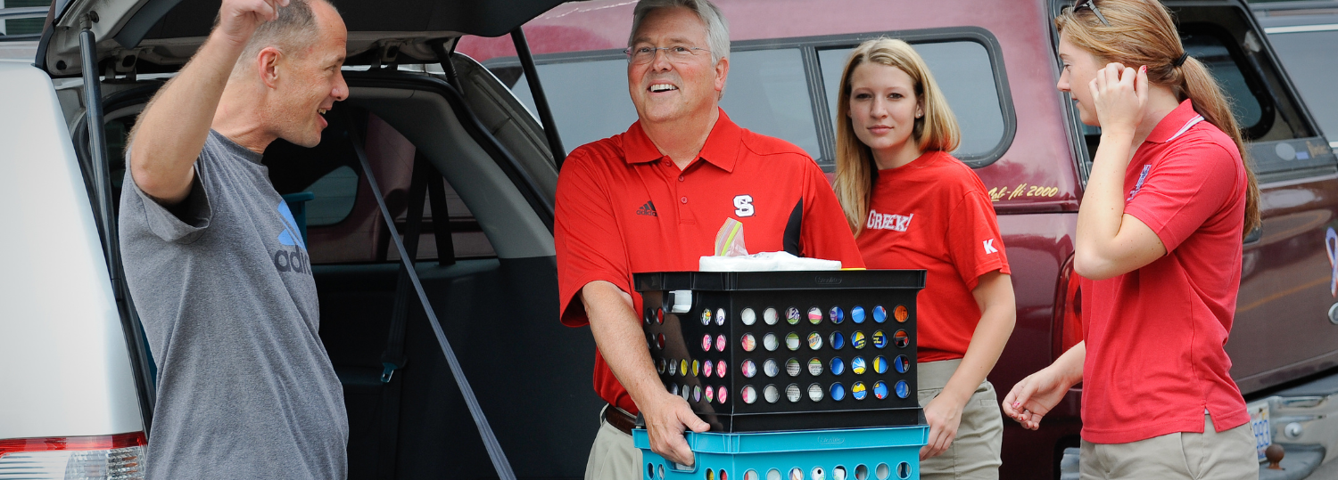 Chancellor Woodson helps students move in during move in weekend. Photo by Marc Hall