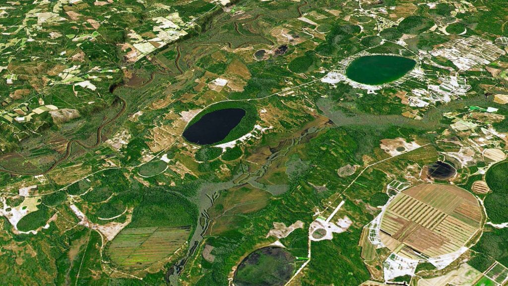 Carolina bays dot the landscape in Bladen County, including Singletary Lake (center) and White Lake (right). (Photo from NASA Earth Observatory)