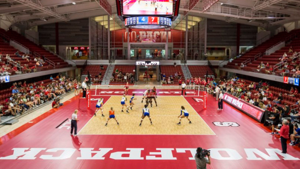 Aerial view of women's volleyball match being played in Reynolds Coliseum