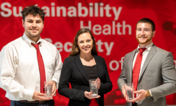 Nick Berinson, Colin Lawler and Mallory Padgett hold their 1st place trophy for ISE 2022 Design Day