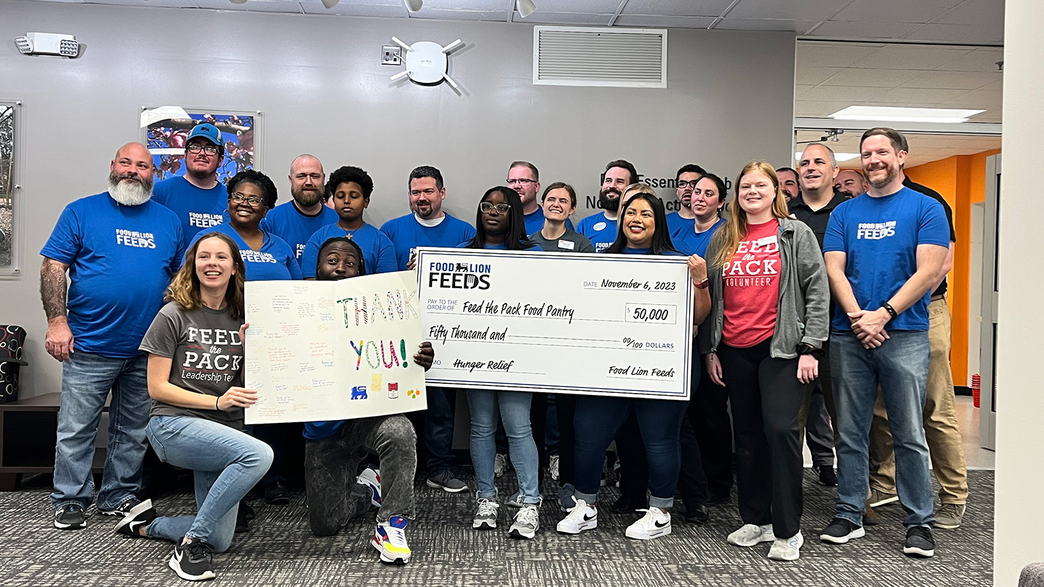 Food Lion Feeds staff presented a check for $50,000 to Feed the Pack staff at NC State's Pack Essentials Hub in North Hall.