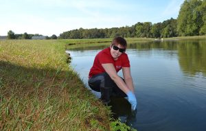 Dr. Audrey Matteson, a member of Polizzotto’s field-driven research lab, collects field samples from areas at risk for water contamination.