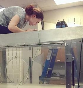 Alex Hsain working on a wind tunnel at Texas A&M University as part of a summer research experience.