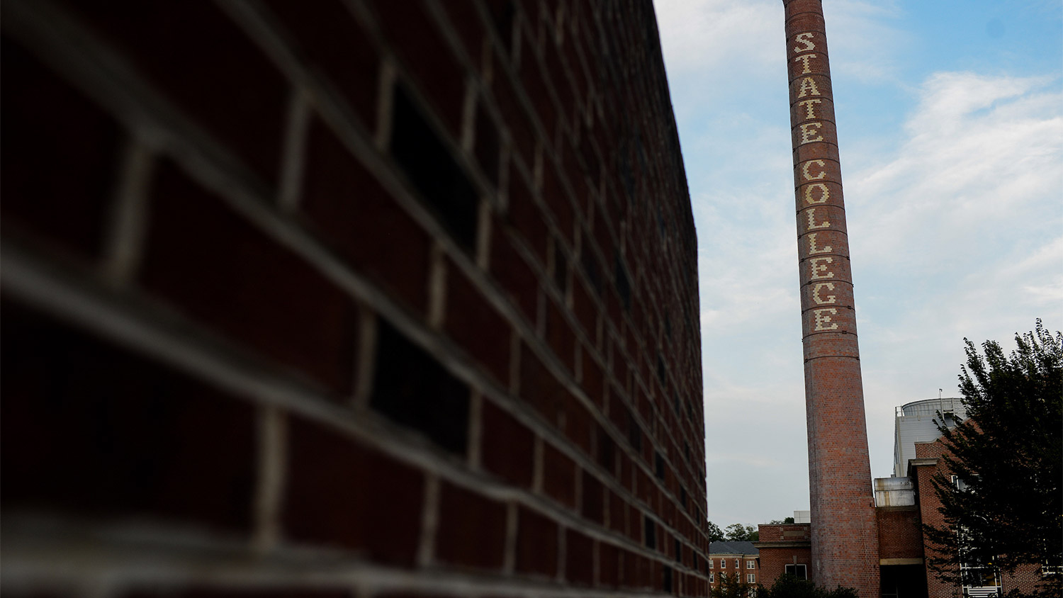 State College smokestack of Yarbrough Steam Plant against blue skyline. steam, energy