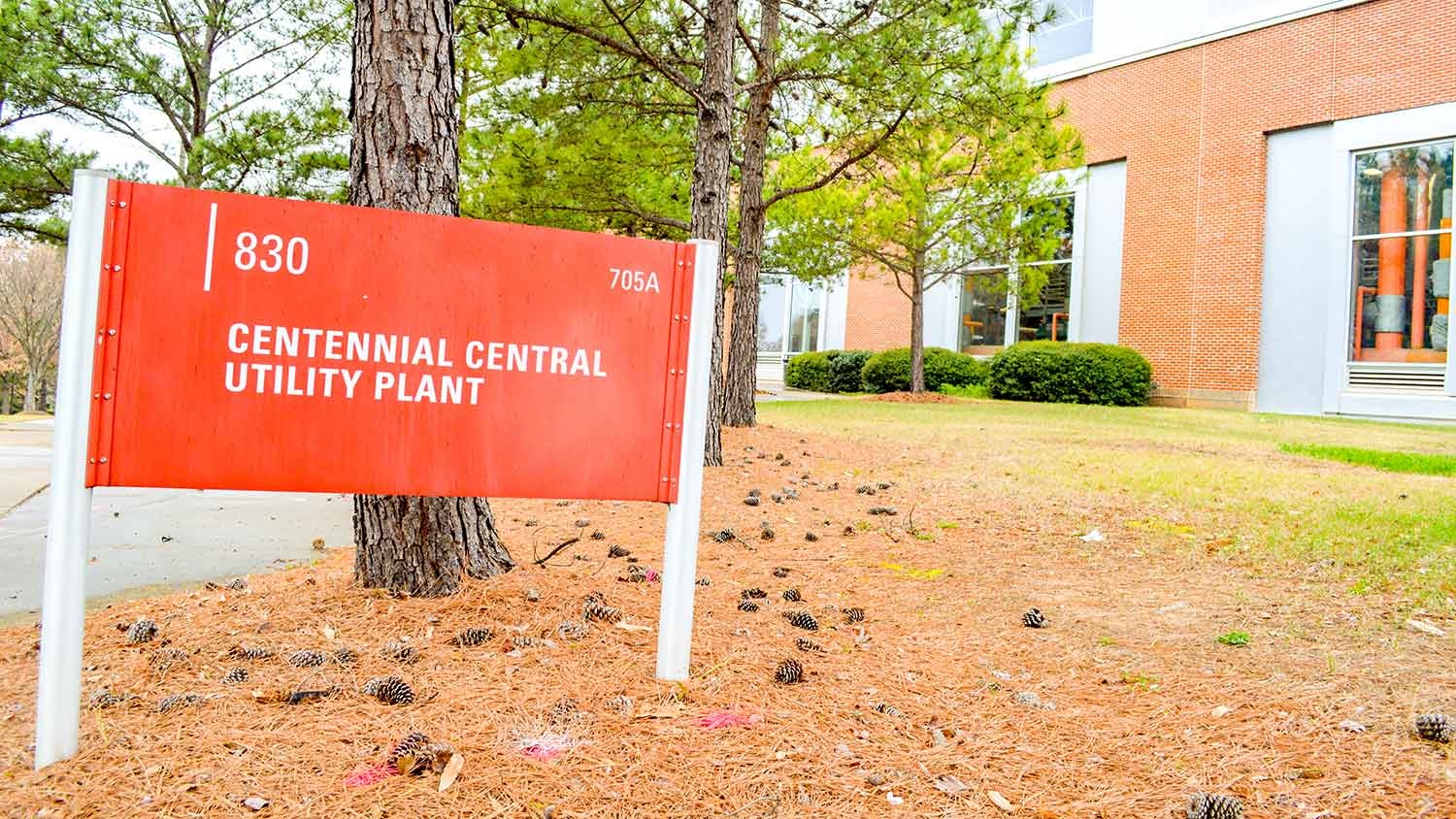 Red sign that reads Centennial Central Utility Plant.