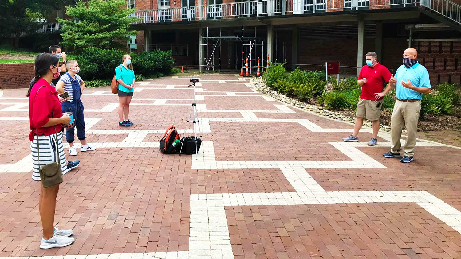 Shown on right, Jon Stephens (Grounds Services) and Rick Hilburn (Landscape Construction Services) record content with the Environmental First Year Program's teaching assistants for a new virtual tour. The virtual tour will enable students to continue meaningful learning about campus sustainability in an online environment.