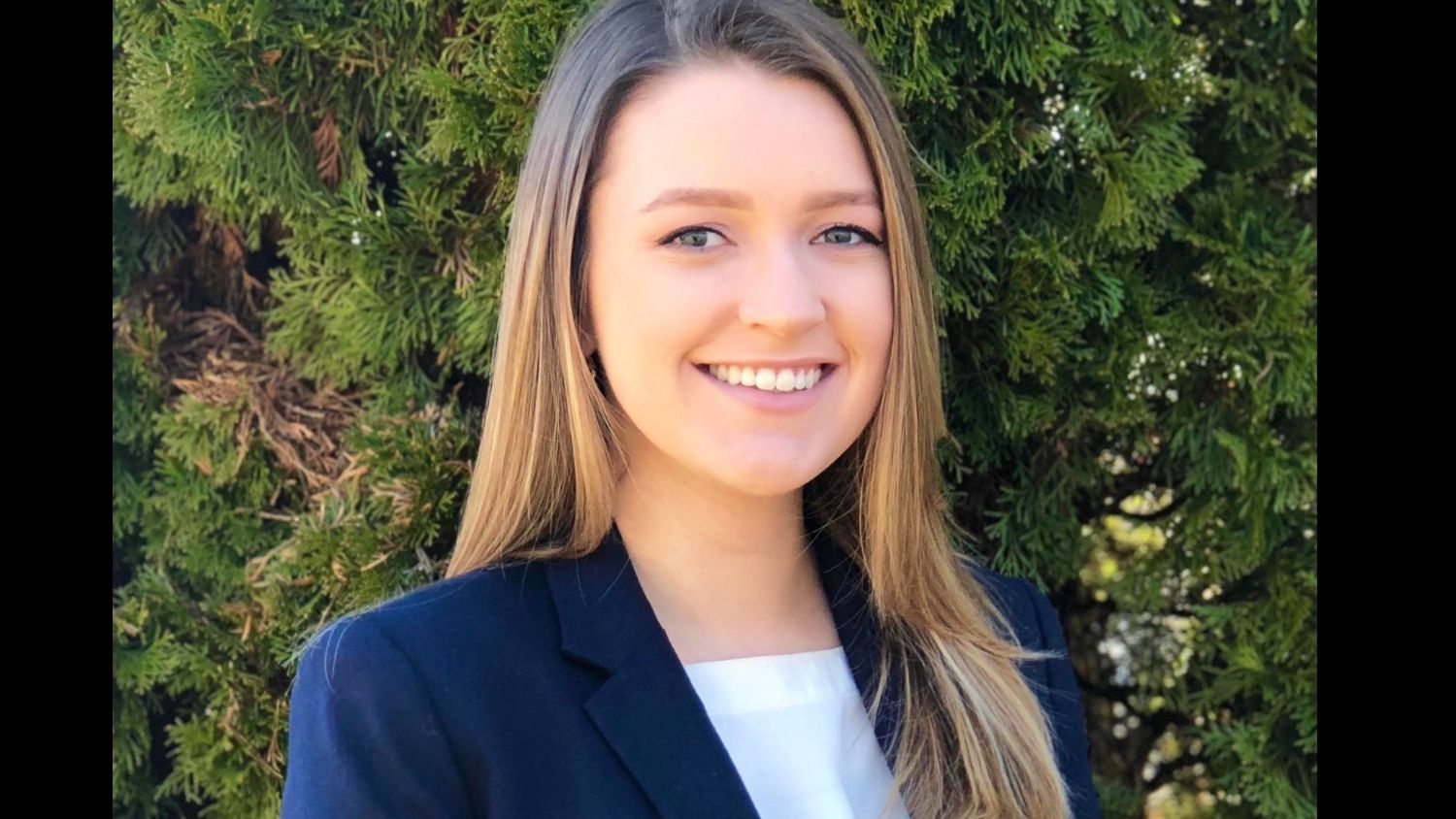 Headshot of Jessica Bast in a white shirt and navy blazer.