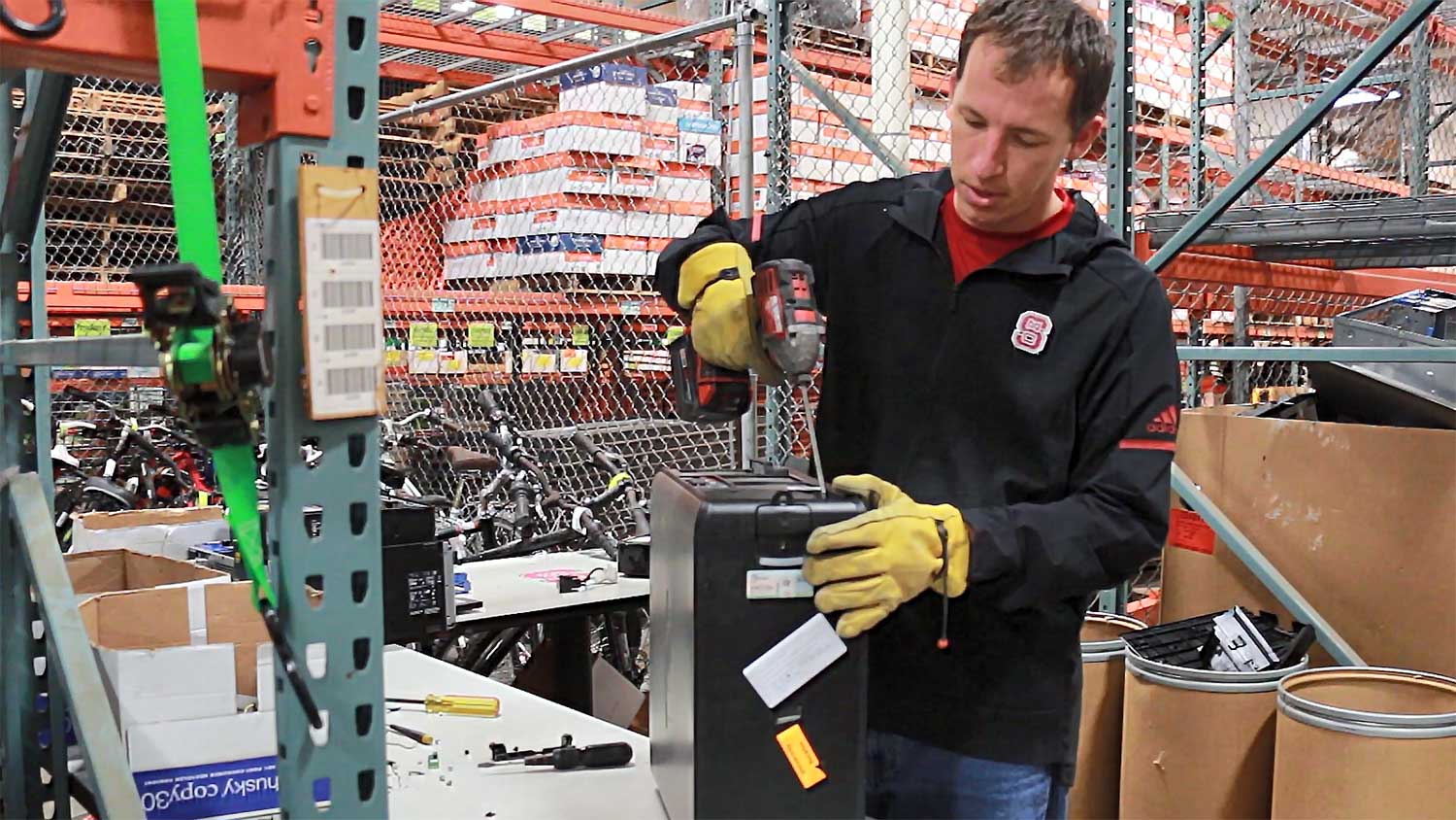 Lance Newsome of the Central Receiving and Surplus Warehouse disassembles a computer tower, which contains precious metals. These metals can only be recycled if removed from the computer tower first.