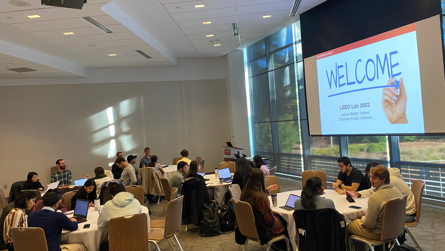 Students gather around tables in Talley to present findings for LEED Lab 2023 Course.