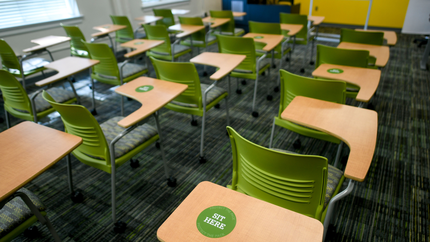 Multiple rows of classroom desks.