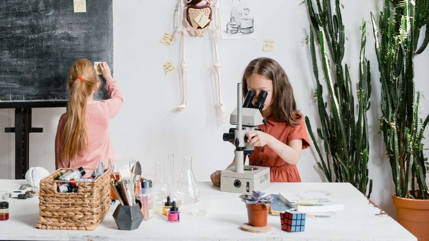 Girl looking through a microscope.