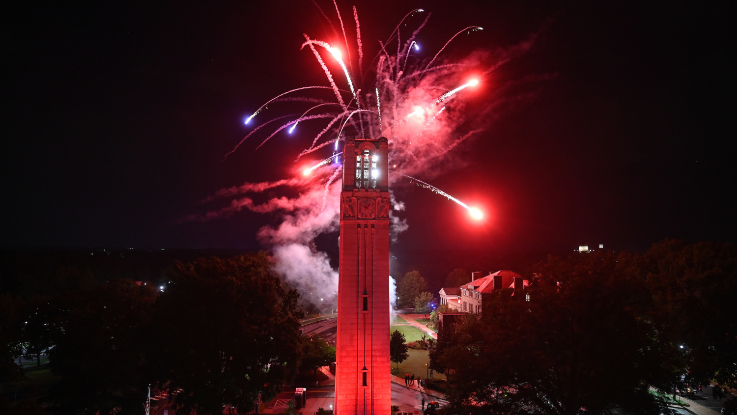 Fireworks explode over the NC State belltower to close down Packapalooza 2022.