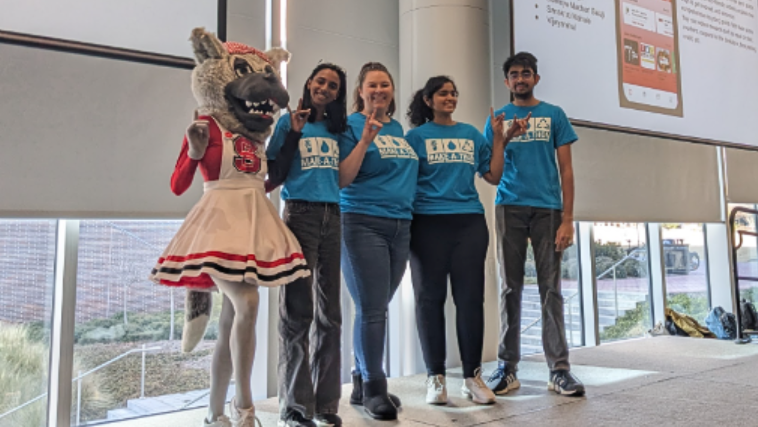 Winning team from Make-A-Thon MAT 2025 pose with Ms Wuf