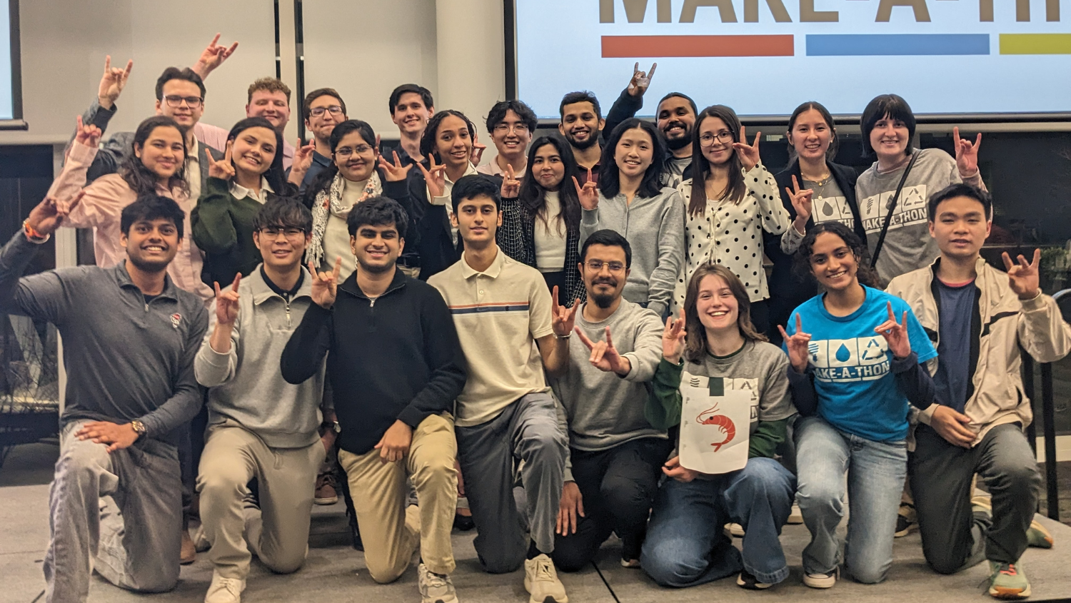Winning student teams from Make-A-Thon 2026 pose on stage